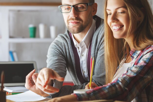 Young guy and girl doing paperwork