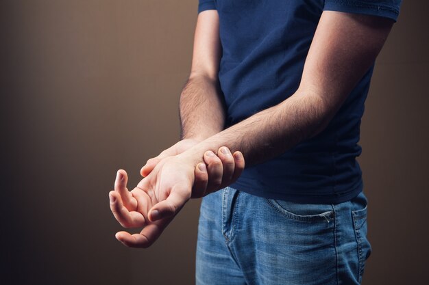 young guy has a sore arm