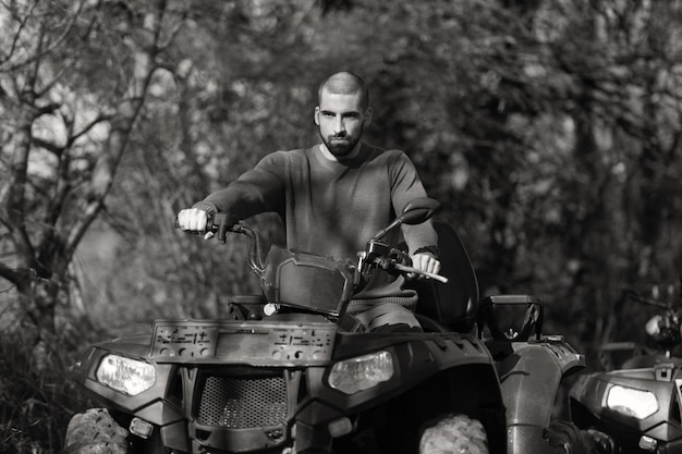 Young Guy Is Riding an Atv Outdoor