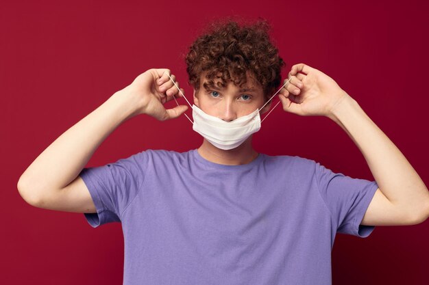Young guy medical mask protection posing isolated background unaltered