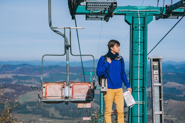 young guy tourist cableway