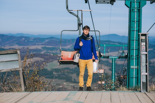 young guy tourist cableway