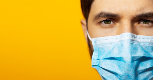 Young guy wearing medical respiratory face mask