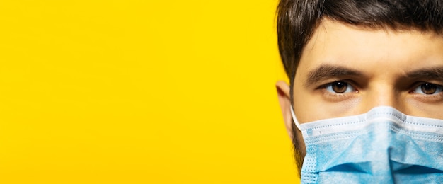 Young guy wearing medical respiratory face mask