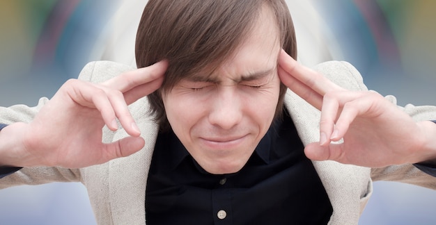 Young guy with headache.