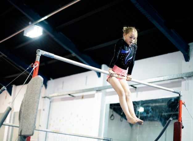 Young gymnast on a horizontal bar