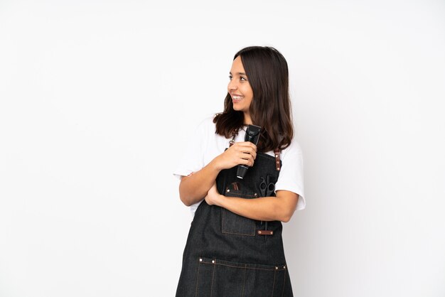 Young hairdresser woman on white happy and smiling