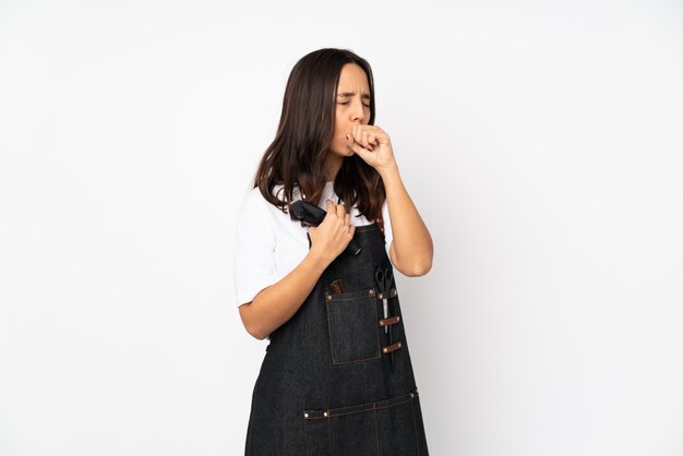 Young hairdresser woman on white wall is suffering with cough and feeling bad