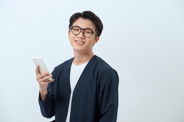 Young handsome asian man using mobile phone