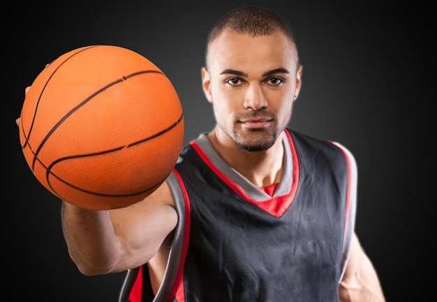 Young Handsome Basketball Player with ball