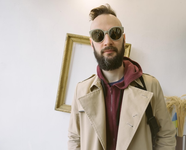 Young handsome bearded hipster man in the city