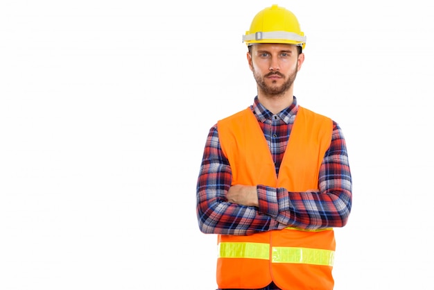 Young handsome bearded man construction worker