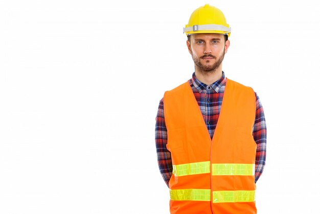 Young handsome bearded man construction worker