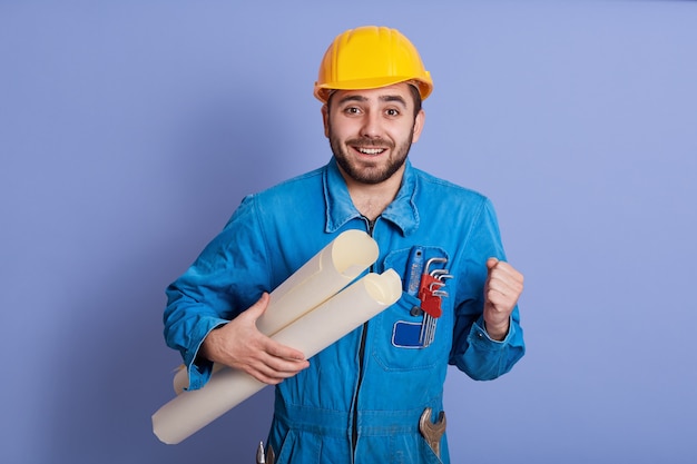 Young handsome bearded man engineer