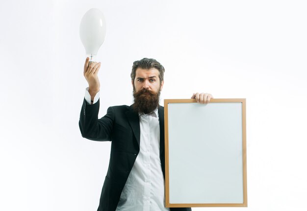 Photo young handsome bearded man scientist or professor holding teacher board isolated on white  idea copy space concept