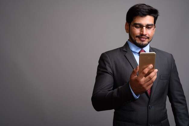 young handsome bearded Persian businessman wearing eyeglasses 