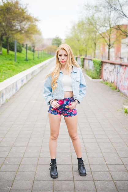 Young handsome blonde girl posing