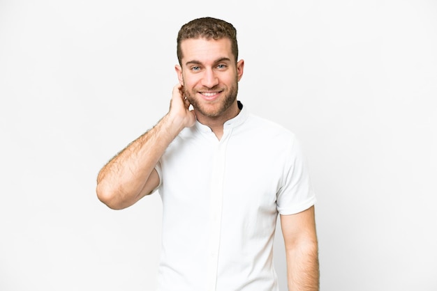 Young handsome blonde man over isolated white background laughing