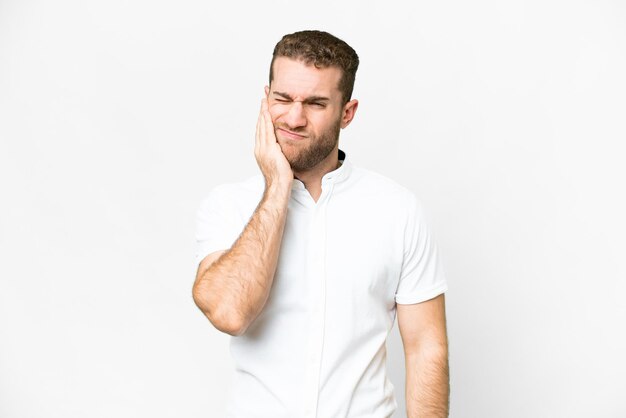 Young handsome blonde man over isolated white background with toothache