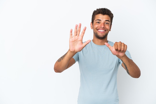 Young handsome Brazilian man isolated on white background counting six with fingers