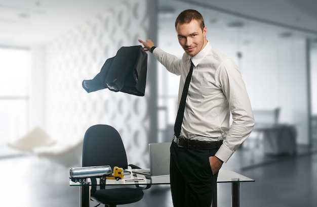 Young handsome business man on a desk