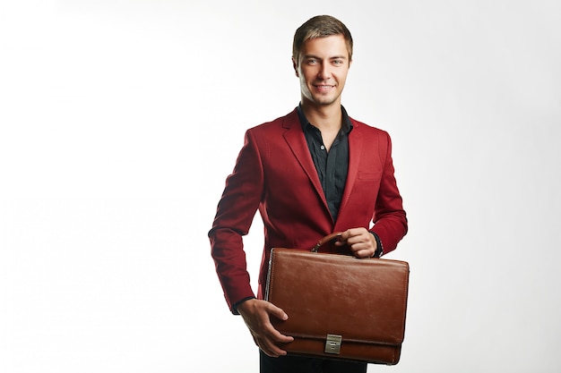 Young handsome business man in red suit