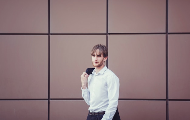 Young handsome businessman in the business center