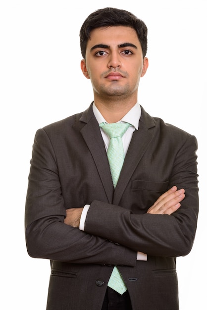 Young handsome businessman looking at camera