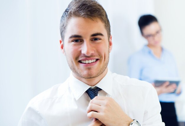 Young handsome businessman in office