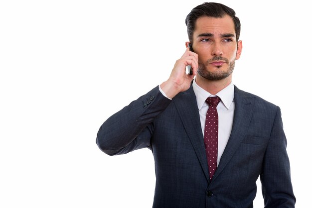  young handsome businessman thinking while talking