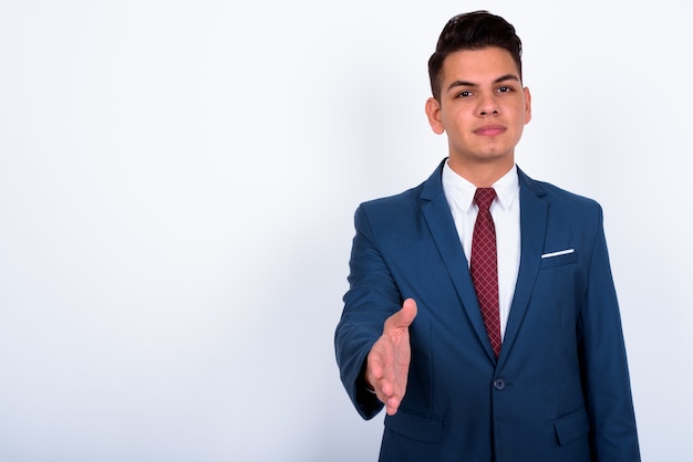 young handsome businessman wearing blue suit on white