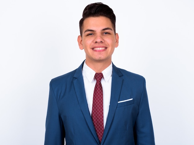 young handsome businessman wearing blue suit on white