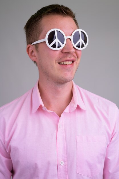 young handsome businessman with pink shirt