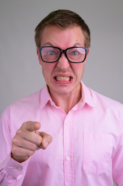 young handsome businessman with pink shirt