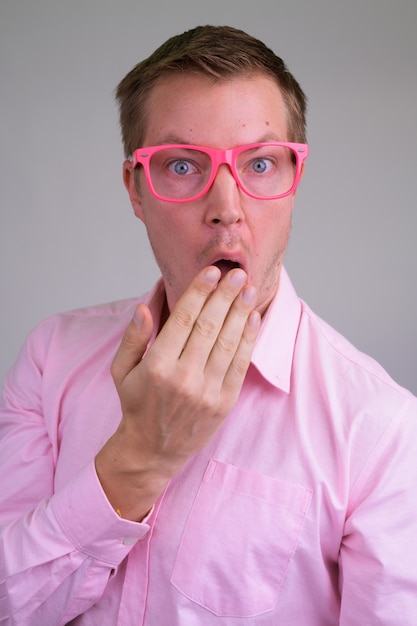 young handsome businessman with pink shirt