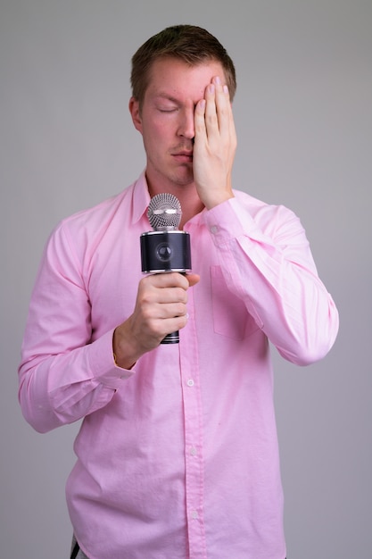 young handsome businessman with pink shirt