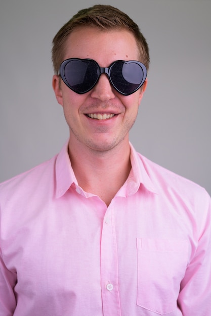 young handsome businessman with pink shirt