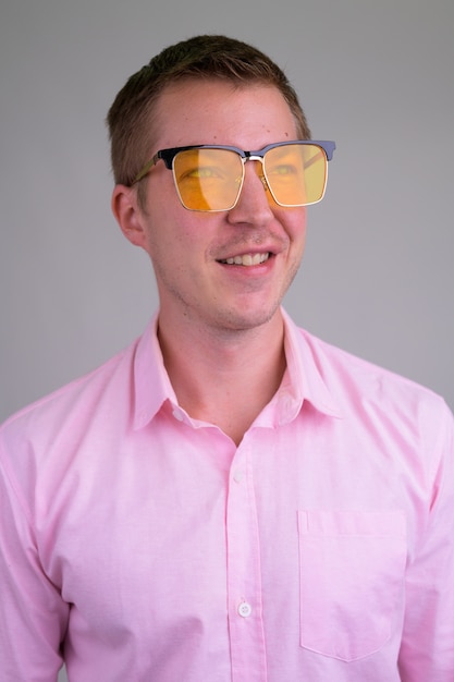 young handsome businessman with pink shirt