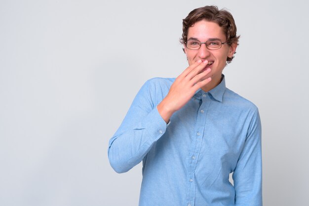 young handsome businessman with wavy hair wearing eyeglasses