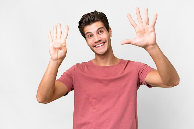 Young handsome caucasian man over isolated white background counting nine with fingers