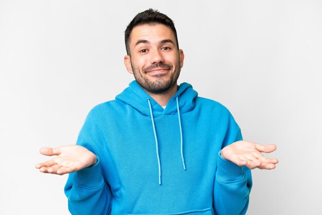 Young handsome caucasian man over isolated white background happy and smiling