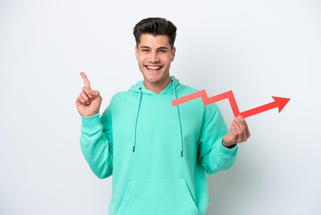 Young handsome caucasian man isolated on white bakcground holding a catching a rising arrow and pointing up