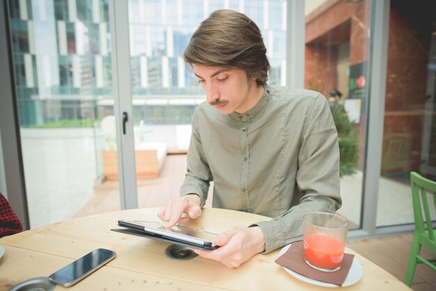 Young handsome caucasian man with moustache