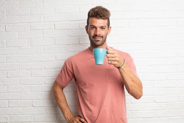 Young handsome cool man having a coffee