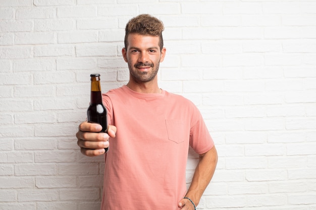 Young handsome cool man offering a beer