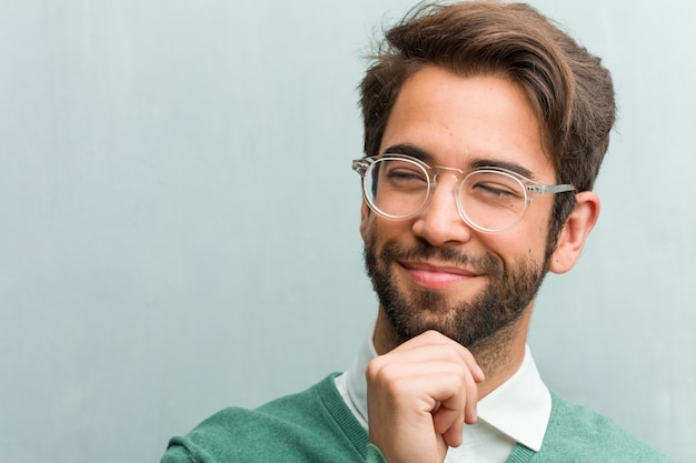 Young handsome entrepreneur man face closeup thinking and looking up