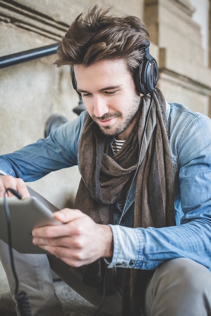 young handsome fashion model using tablet man