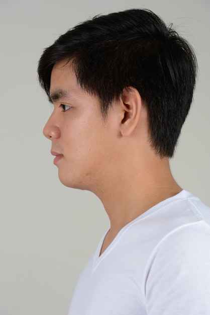 young handsome Filipino man on white