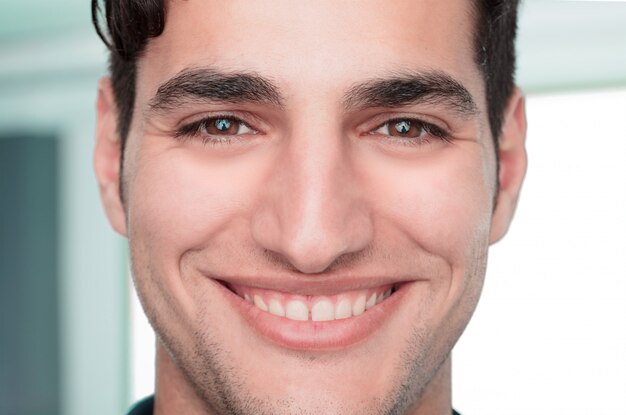 young handsome and happy or surprised man close up portrait