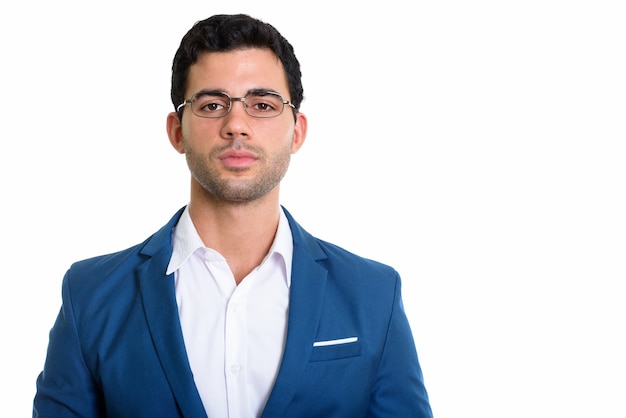 young handsome Hispanic businessman wearing eyeglasses